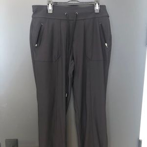 Black tek gear joggers with zipper pockets.